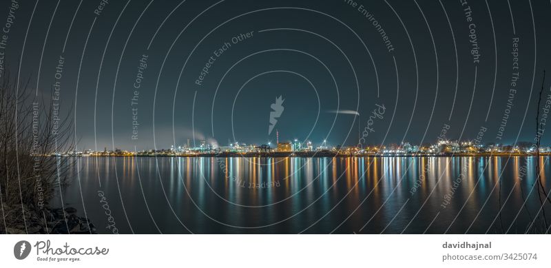 Industrial landscape with the Rhine and the chemical production plants in Ludwigshafen seen from Mannheim. Landscape Germany River Water cityscape Night Dark