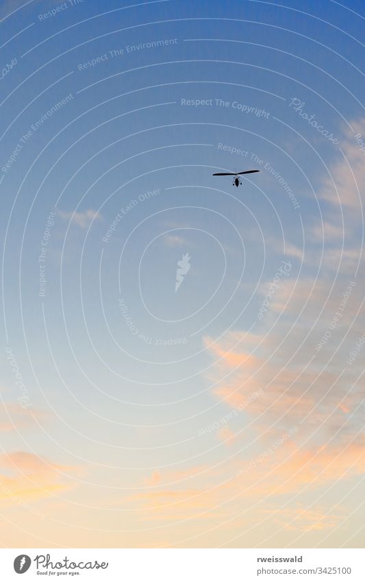 Ultralight plane-clear blue sky with some clouds. Dunhuang Crescent Lake-Gansu-China-0687 ultralight aircraft microlight plane silhouette civilian aviation