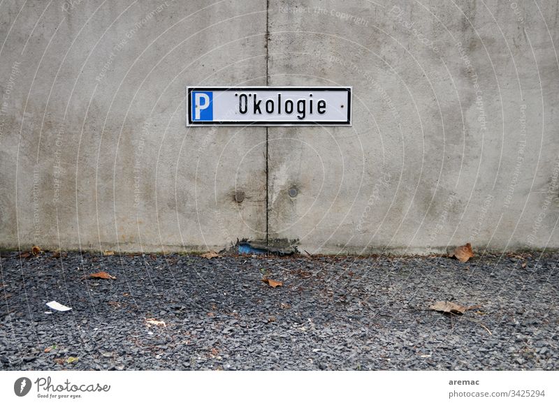 Ecology sign on concrete wall with gravel ecology Parking lot Wall (barrier) Concrete Disagreement Humor Reservation