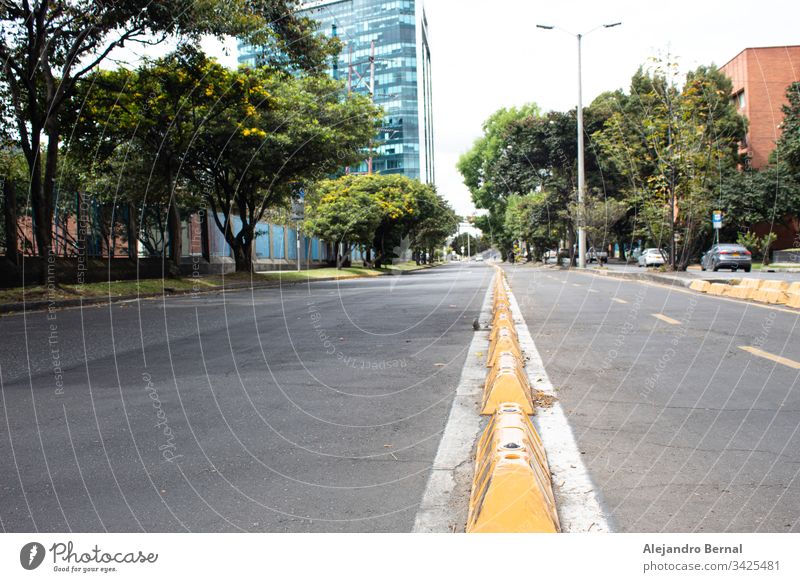 No people Bike path and avenue with modern city and cars at background in sunny day architecture asphalt bicycle bicycle lane bicycles bike bike path bikers