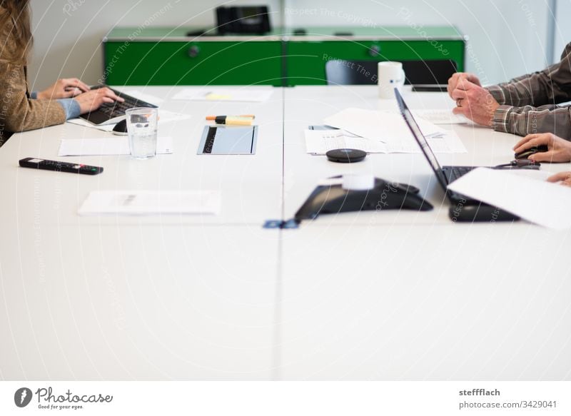 Conference table with hands of three conference topics work meeting laptop people Office office Keyboard Phone conference call Table Workplace Coffee cup