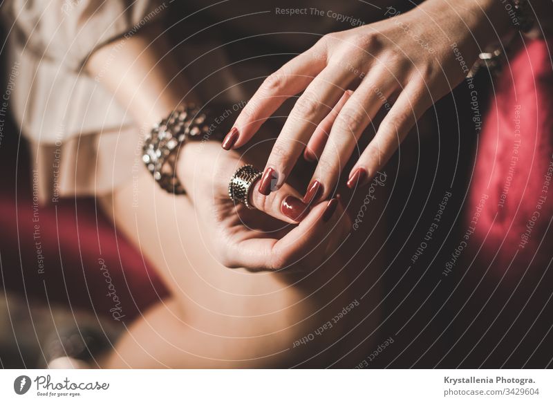 Elegant young woman's hands with painted nails and jewellery rings red nails elegant elegance young girl beautiful female feminine Woman Youth (Young adults)