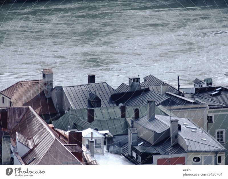 Roofs of a city on a river photographed from above House (Residential Structure) River Water Danube Passau Town rooftop landscape roofs Gray Deserted Day