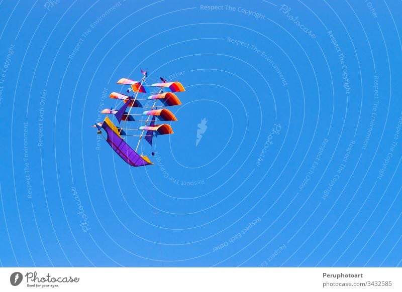 Traditional boat-shaped kite in the skies of Bali - Indonesia. bali ship sky summer blue sail sport asia beautiful vessel holiday wind tradition ocean toy