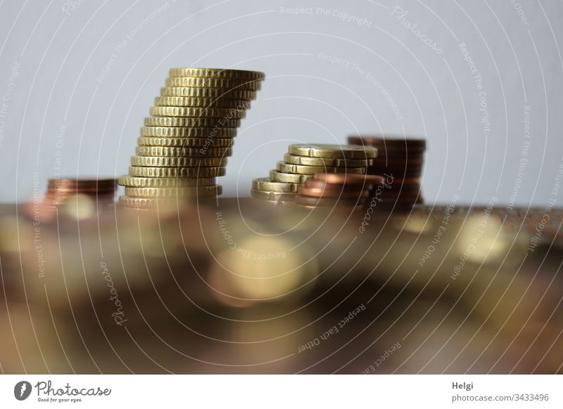 Euro coins, small change, lying stacked on a table Coins euro coins Cent euro cents Money Save Loose change Paying Close-up Deep depth of field Interior shot