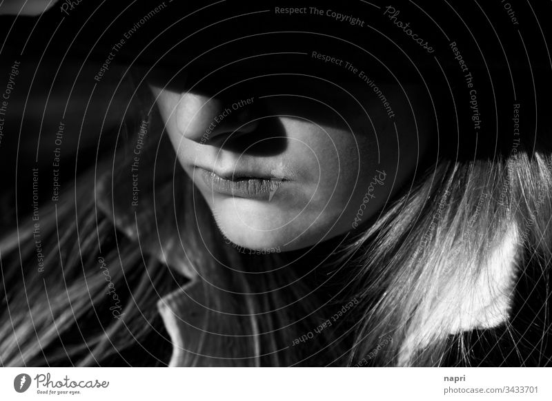 gloomy views | black and white portrait of a young woman Young woman Portrait photograph Face Contrast Light and shadow somber depression melancholically