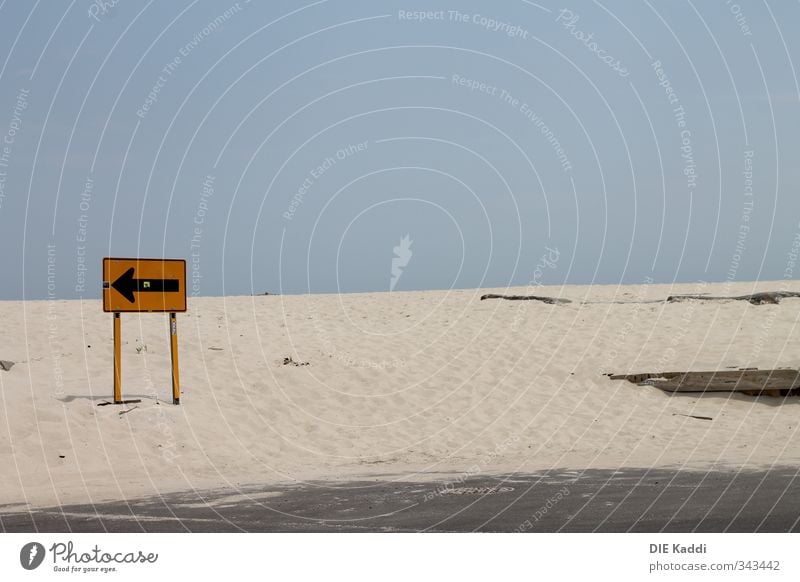 Away from the beach Summer Summer vacation Beach Horizon Stone Sand Wood Metal Arrow Natural Blue Yellow Signs and labeling Roadside calvery Colour photo