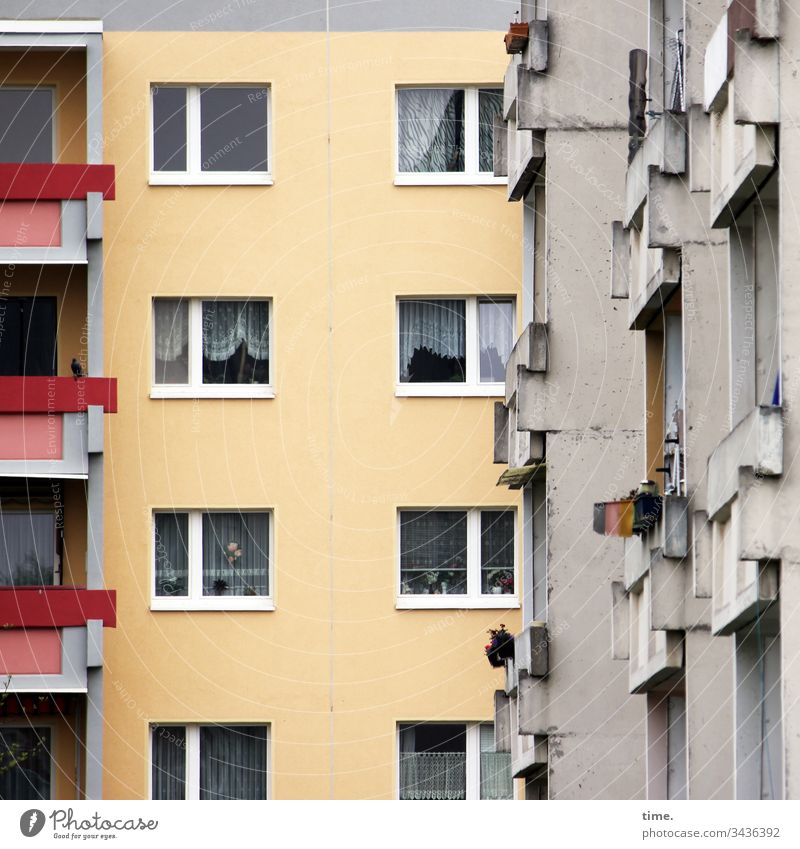 Neighborhood, presumably clairaudient House (Residential Structure) Window Curtain Gloomy Gray Yellow Red Balcony Narrow neighbourhood Near High-rise dwell