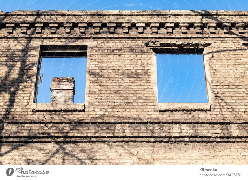 Ruined old house. And the blue sky. The remains of old houses. Abandoned city. The city of ghosts. The ruins of old historic buildings destroyed by an earthquake.