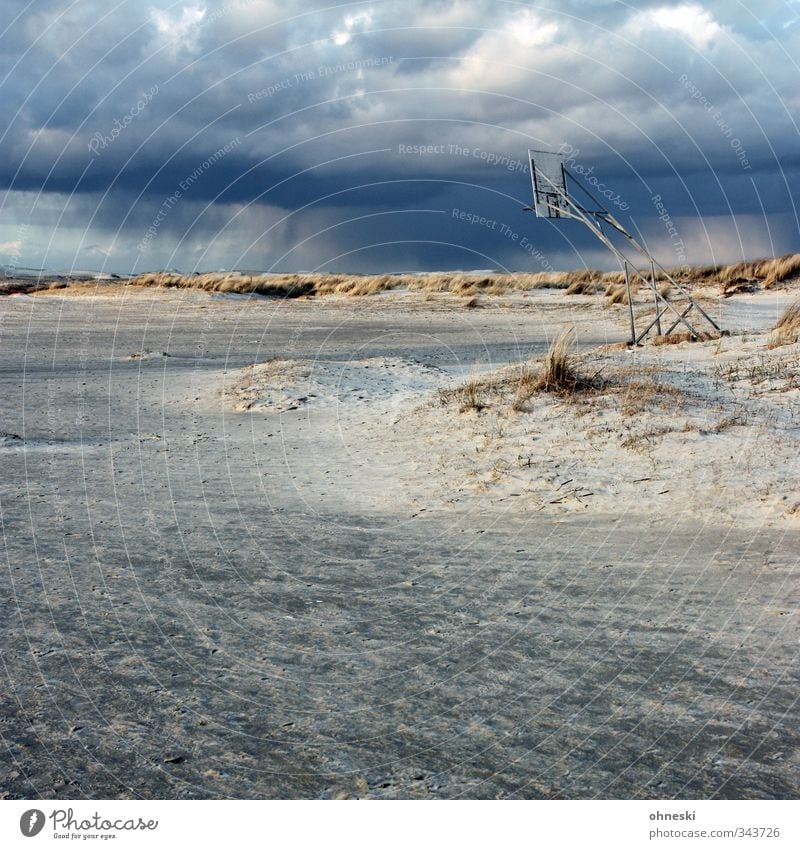 playground Playing Playground Basketball Basketball basket Elements Sand Storm clouds Rain Coast Beach North Sea Island Borkum Dune Dark Apocalyptic sentiment