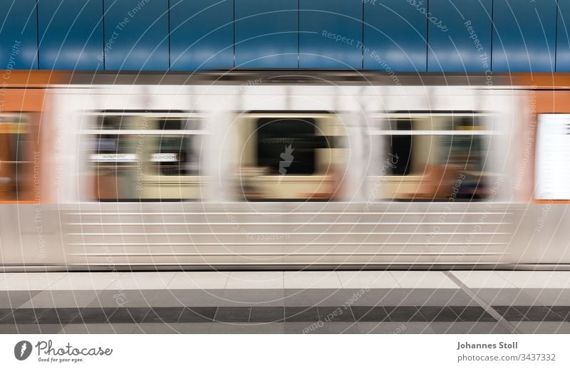 Passing silver subway car in front of blue wall Underground Commuter trains Tram PUBLIC TRANSPORT Hamburg Mono rail Local traffic Urban transport Car-free