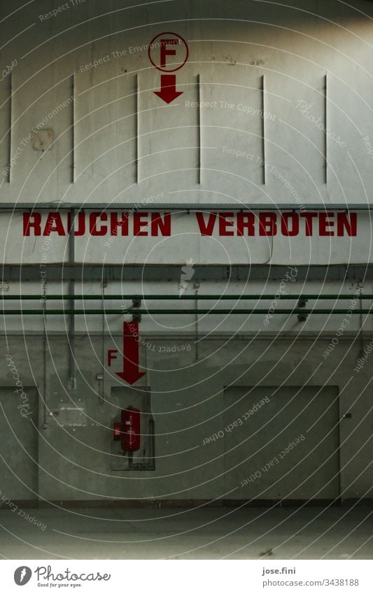 No smoking, written in big red letters on the wall of the abandoned hall of the airfield Hall Room Airfield Old forsake sb./sth. Smoking Warn Dangerous Fire