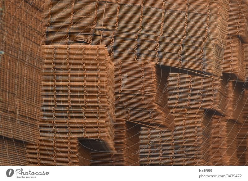 Stack of steel mats Grid Rust Industry Steel Old Metal Pattern Structures and shapes Detail Close-up Grating Industrial Abstract Grunge Consistency Deserted