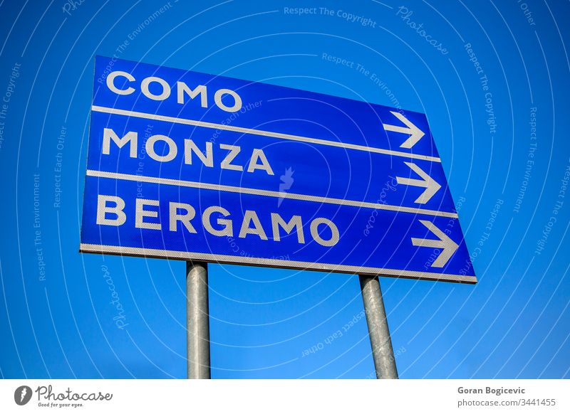 Cities direction italy street sign italian sky pole information signpost space ad panel board como city display advertising monca arrow announcement advertise