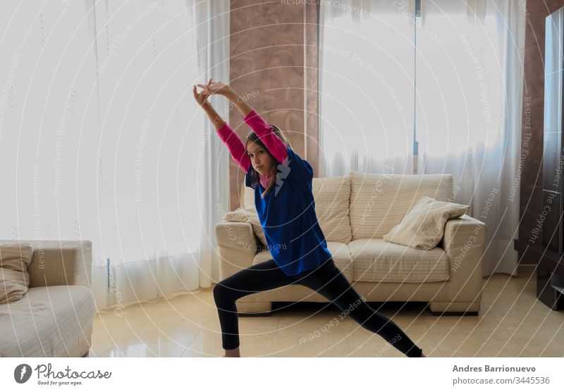 Little girl with sportswear posing elementary friendly living little sincerity casual sofa model love playful child cute lifestyle expression expressive good