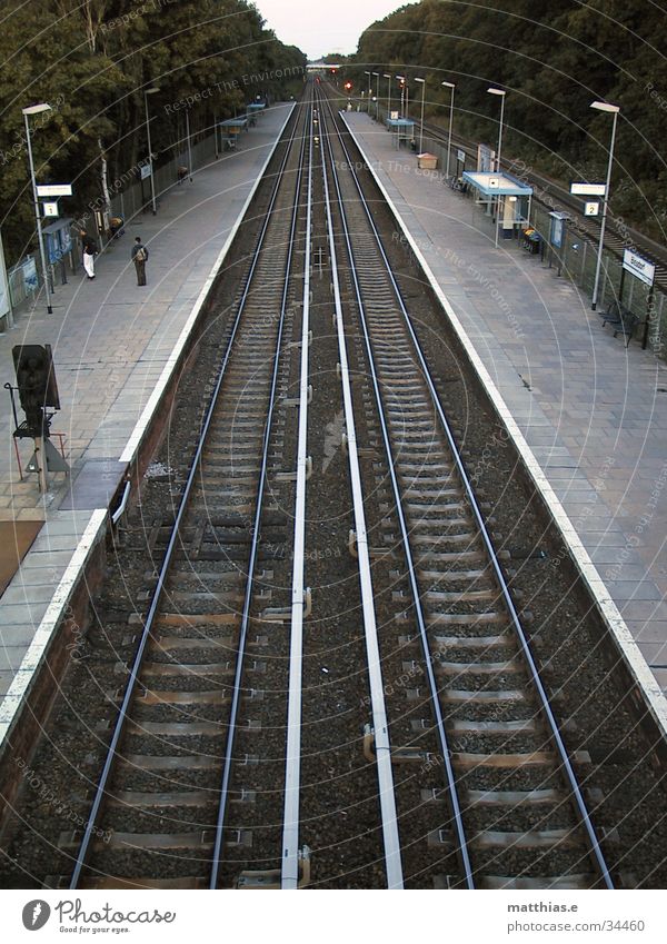 Double-track Commuter trains Railroad tracks Platform Vanishing point Perspective Transport Berlin biesdorf Train station Lanes & trails Wait Human being