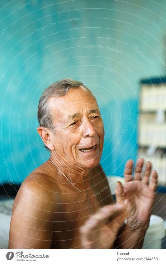 ancient man in a supply store-trinidad cuba caribean island cuban man old old man portrait handsome nice cute people street real people lifestyle smile