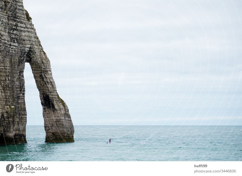 Rock with SUP approaching rocky coast rock pear Slope Vantage point Landscape Panorama (View) Sky Vacation & Travel Tourism Far-off places Travel photography