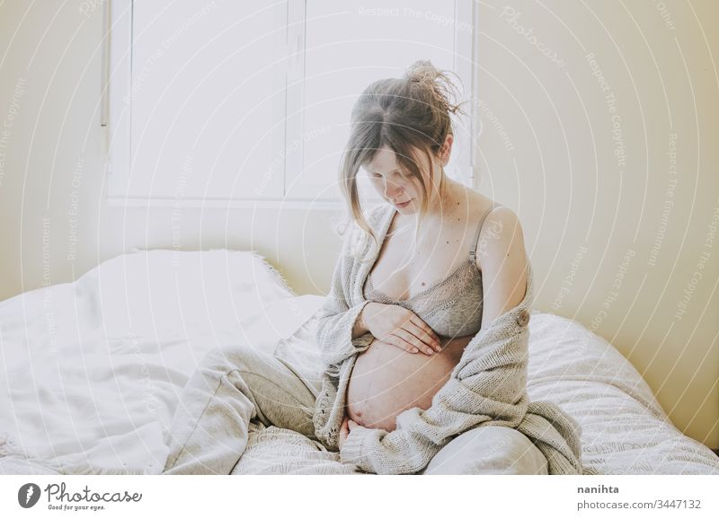 Young pregnant woman alone in home in quarantine pregnancy mother mom isolated at home family love health care lonely tired insomnia pretty beauty beautyful