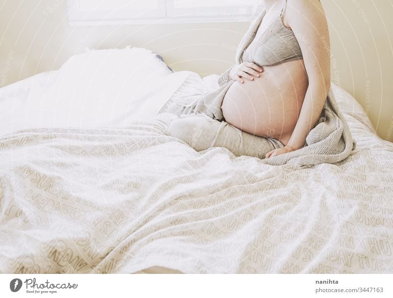 Young pregnant woman alone in home in quarantine pregnancy mother mom isolated at home family love health care lonely tired insomnia pretty beauty beautyful