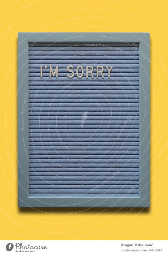 Light blue message board I`m sorry on the yellow background apologize apology banner card concept creative decoration decorative design emotion excuse feeling