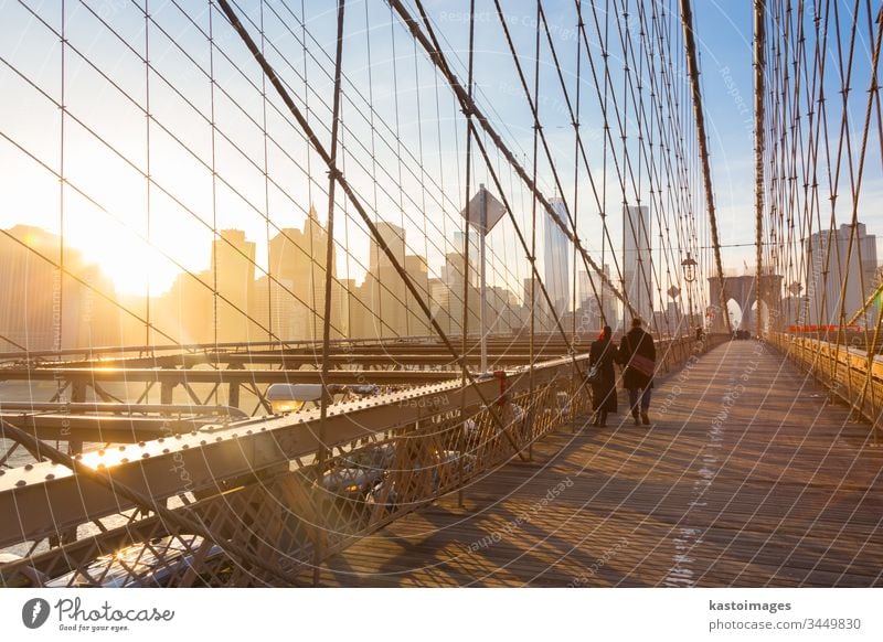 Brooklyn bridge at sunset, New York City. new york manhattan America brooklyn couple walk city skyline people usa skyscraper new york city cityscape romantic