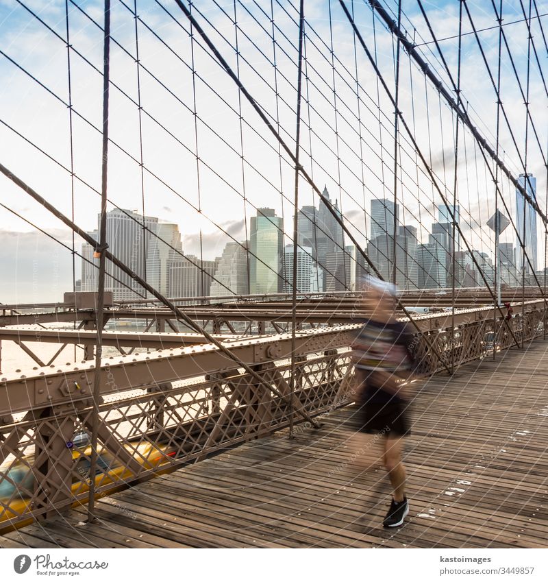 Brooklyn bridge at sunset, New York City. new york manhattan America brooklyn city skyline people usa skyscraper new york city run sport runner cityscape