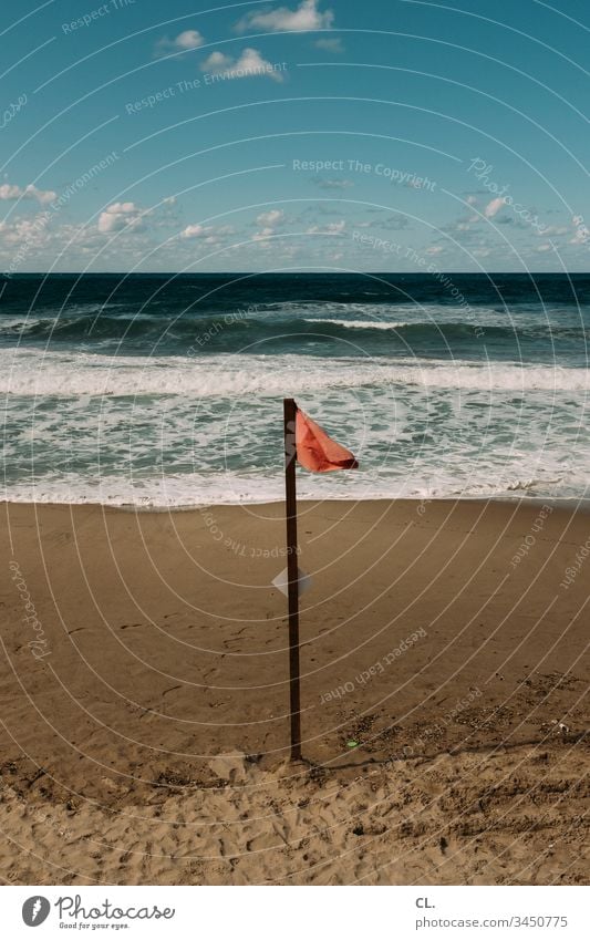 red flag on the beach Ocean Water Coast Sky Beautiful weather Beach Sand Red bathing prohibition Bans forbidden Exterior shot Deserted Colour photo