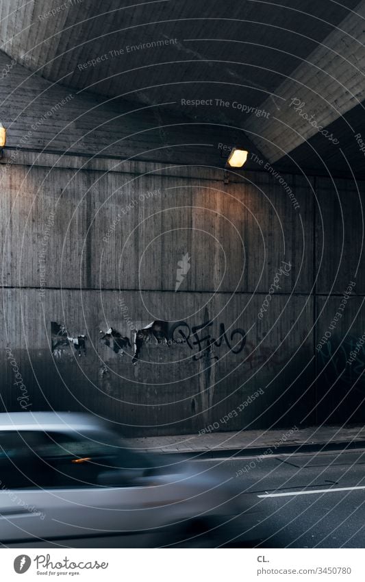 car driving under a bridge Street Motoring Movement Motion blur Deserted Exterior shot Colour photo Traffic infrastructure Speed Road traffic Driving Transport