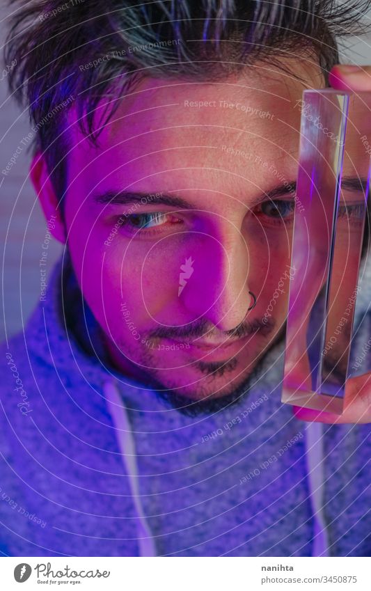 Artistic and futuristic portrait of an attractive young man guy face prism effect modern casual light art abstract artistic portraiture cool beard bearded