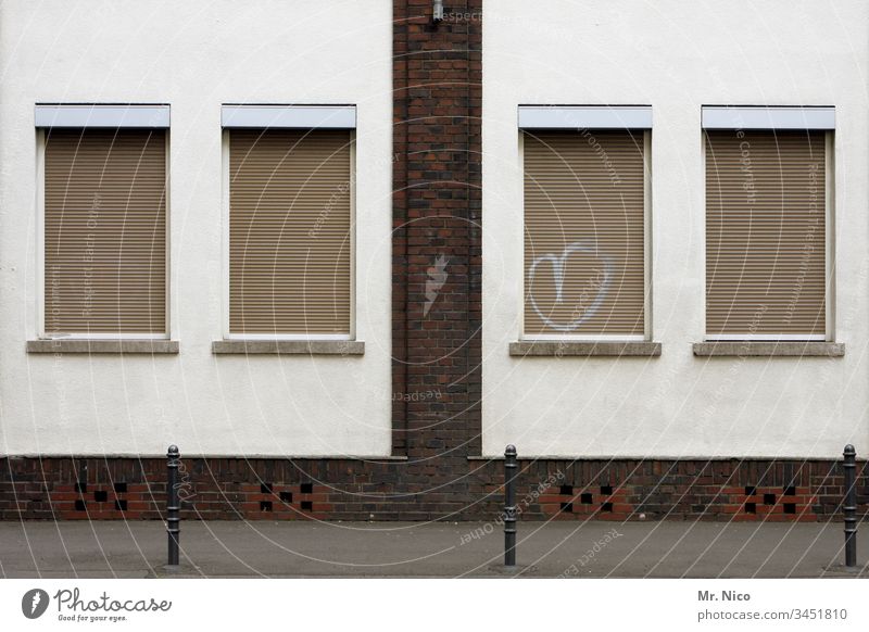 Window with heart House (Residential Structure) Building Facade Bollard Architecture Manmade structures Street Sidewalk roller shutter Closed clinker facade