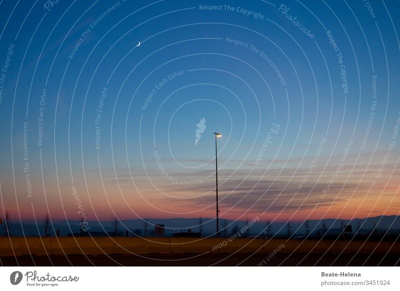 colorful evening mood on the beach with crescent moon and spotlights Colour colourful Beach Crescent moon streetlamp Floodlight sunset Sunset Sunset sky Sky