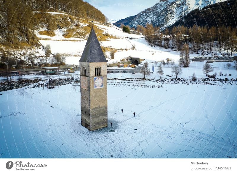 church tower frozen lake Ice Ice-skating Lake Frozen Frozen water Kite Skiing Cold reschenpass Drone drone flight drone view Drone pictures Winter landscape