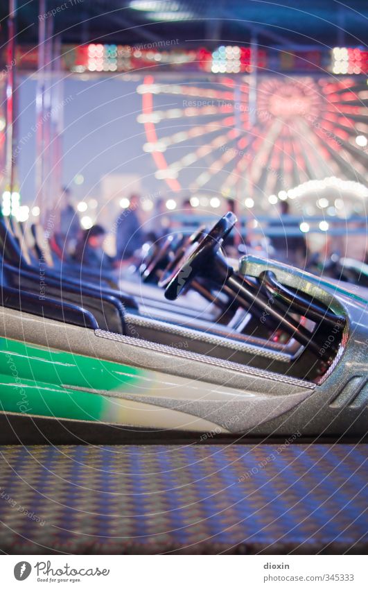 on a confrontational course Leisure and hobbies Fairs & Carnivals Bumper car Ferris wheel Joy Happiness Joie de vivre (Vitality) Theme-park rides Colour photo