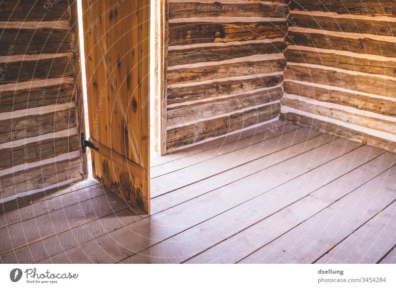 Simple wooden hut with open door Building Adventure Subdued colour Abandoned house forsake sb./sth. Interior shot Lonely Calm Room straightforwardness