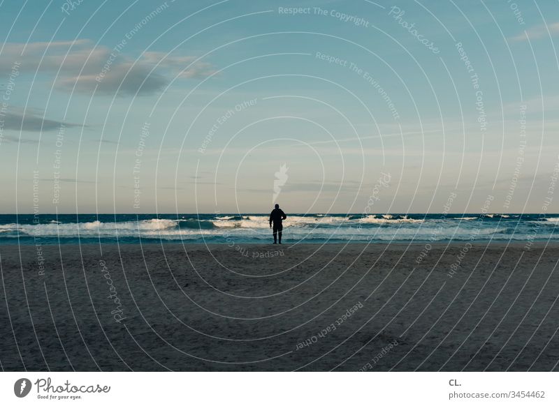 Man by the sea person Human being Adults 1 Stand Ocean Italy Sky Beautiful weather Blue sky Beach on one's own Sand relaxation tranquillity Exterior shot