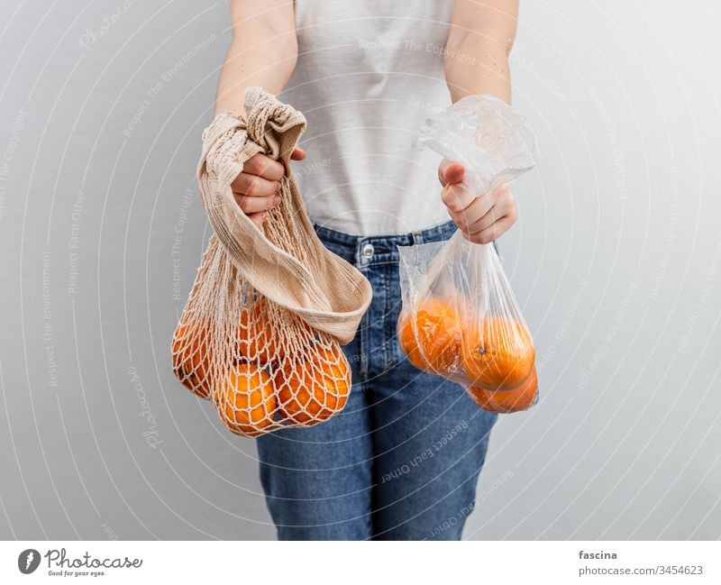 Zero waste, food waste concept. zero waste oranges fruits plastic bag textile mesh top view flat lay plastic-free eco bag reusable bags fabric pouch product