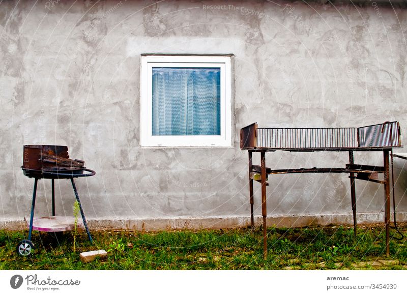 Barbecue in front of a wall with window in a harvesters accommodation Wall (building) Gray Building Window Barbecue (apparatus) Seasonal farm worker