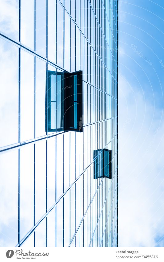 Modern facade of glass and steel. background sky cloud skyscraper abstract economy architecture real estate blue commercial office construction exterior city