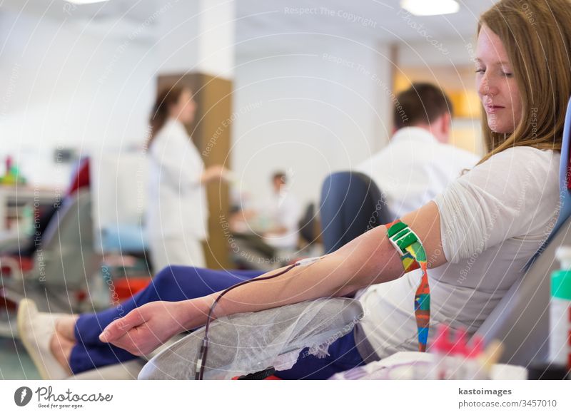 Nurse and blood donor at donation. blood donation health care laboratory transfusion medical hospital indoors arm man patient male medicine clinic transfused