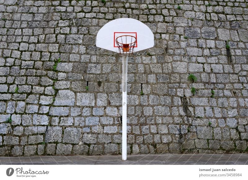 street basket hoop in Bilbao city Spain, sport on the street basketball sport equipment play playing game competition abandoned old court field park playground