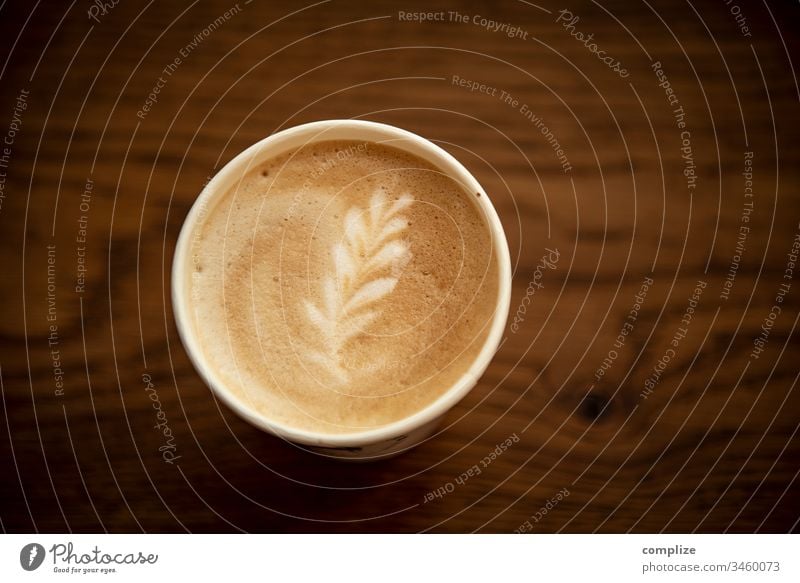 Latte Macchiato with flowers latte Latte macchiato Cappuccino take away to go Wood Wooden table milk foam Pattern Flower Heart Foam cafe Coffee creation