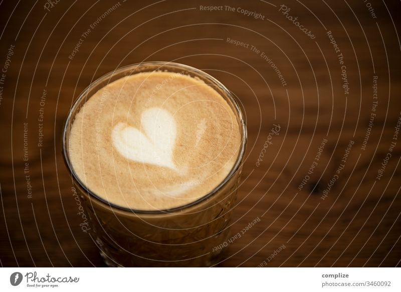 Latte Macchiato with hearts latte Latte macchiato Cappuccino take away to go Wood Wooden table milk foam Pattern Flower Heart Foam cafe Coffee creation