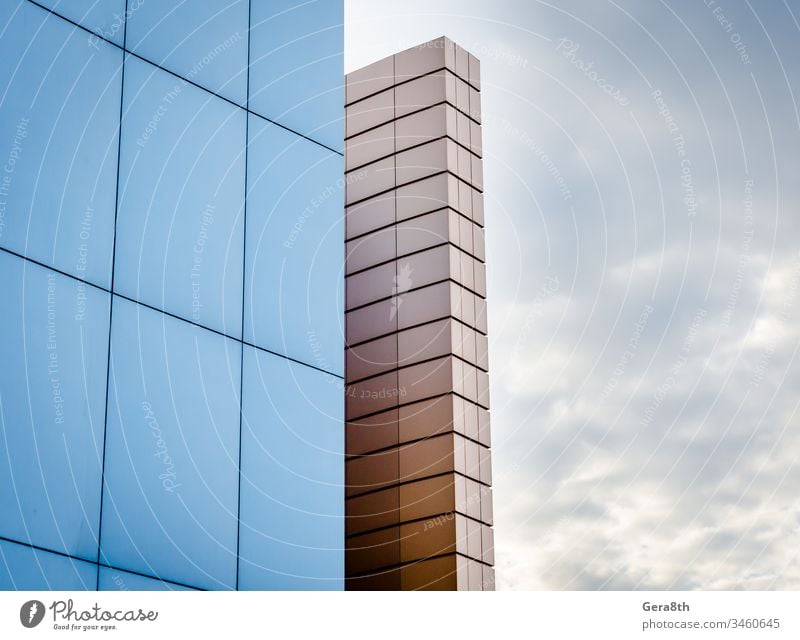 fragment of the building wall against the background of the autumn sky architecture blocks blue cloudy fragment of building fragment of wall geometric house