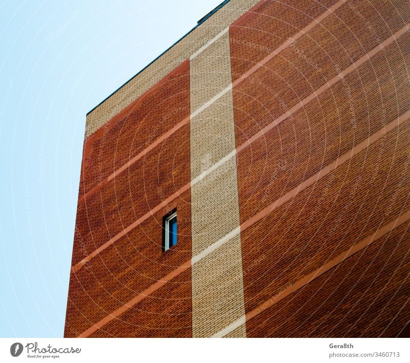 high wall with single window on blue sky background architecture billet blocks bricks house orange pattern structure template