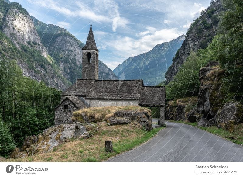 A church in Val Verzasca in Ticino, Switzerland Lavertezzo Exterior shot Canton Tessin Colour photo Landscape Roman arch bridge Morning Verzasca Valley Europe