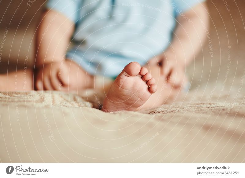 the feet of a small child. Newborn's little fingers. cute little baby feet foot newborn mother beautiful white family closeup love care hand healthy human life