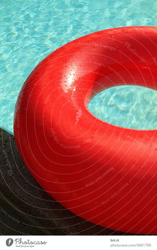 Full to bursting, the large red swimming ring lies on the edge of the pool, in the turquoise water. Swimming & Bathing Swimming pool Water Summer Blue Joy