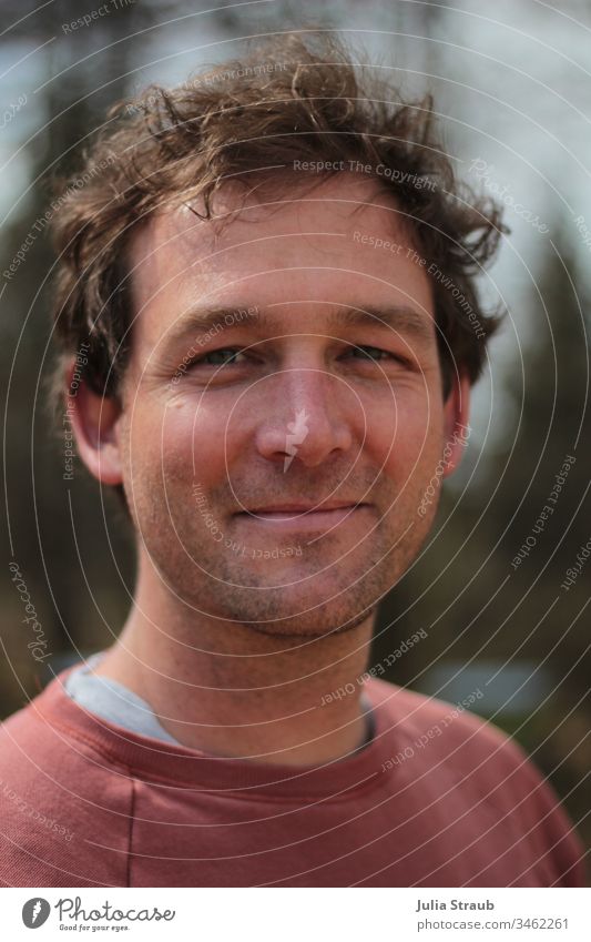 Portrait of a man Portrait photograph Curl short hair Short-haired blue eyes Designer stubble Sweater Grinning Man scruffy Face