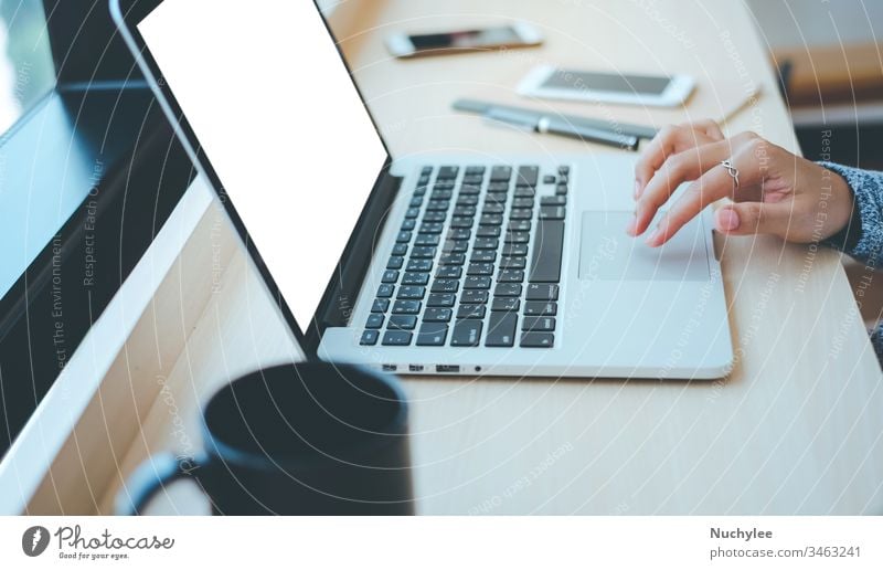 Close up hands of young businesswoman typing on computer laptop with blank screen at the office or cafe, business concept asian brainstorming busy casual